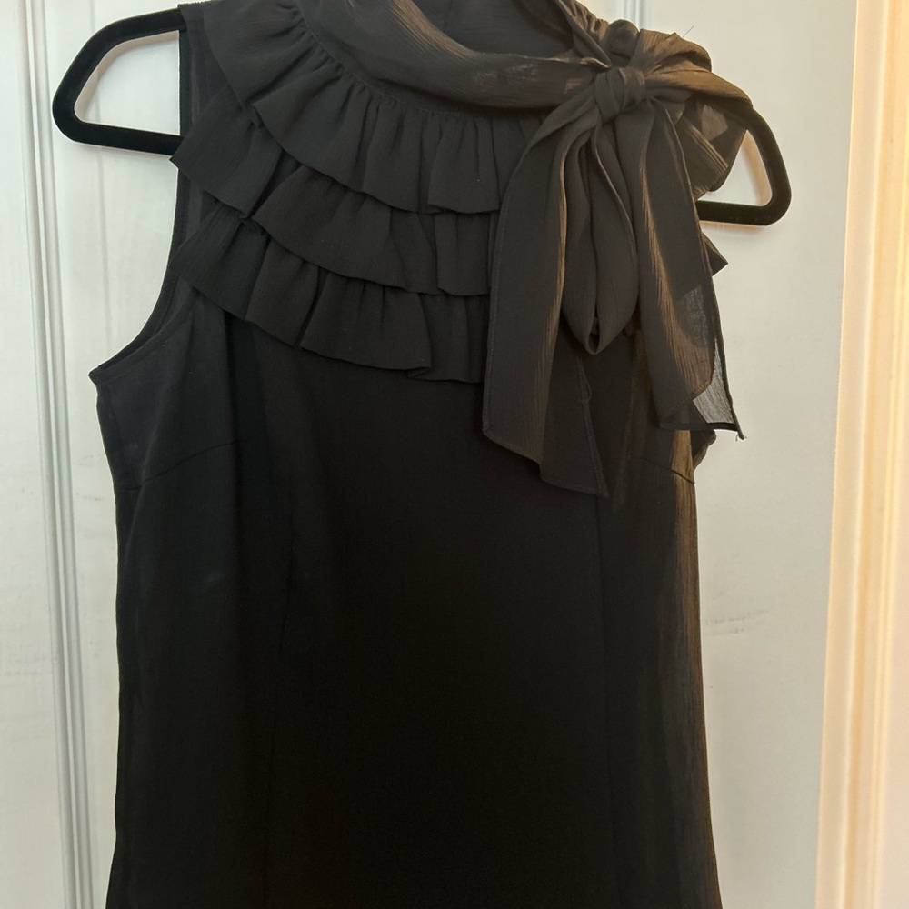 Elegant Black Sleeveless Top with Ruffle Detail